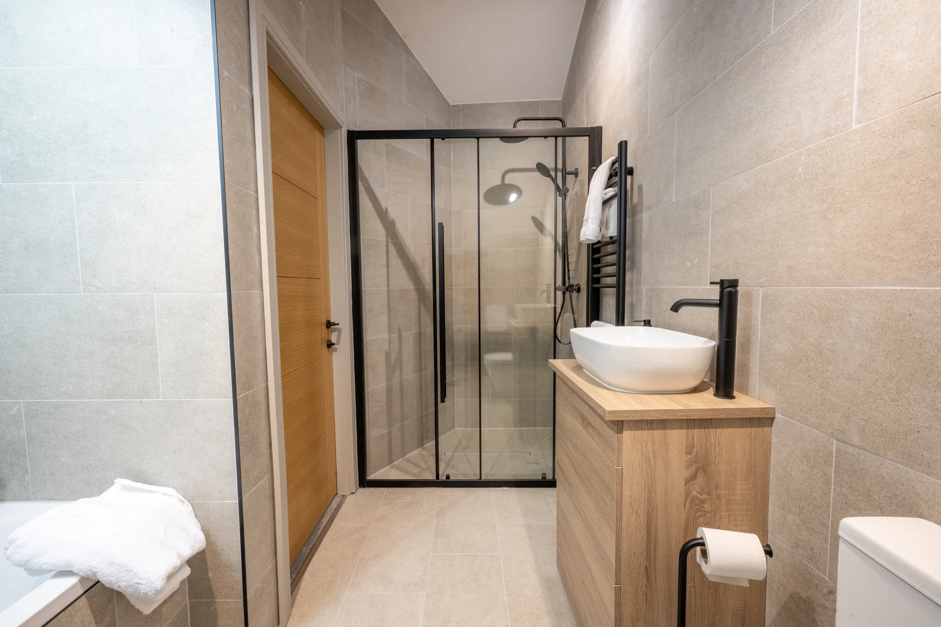 Bathroom with a glass shower enclosure and vessel sink